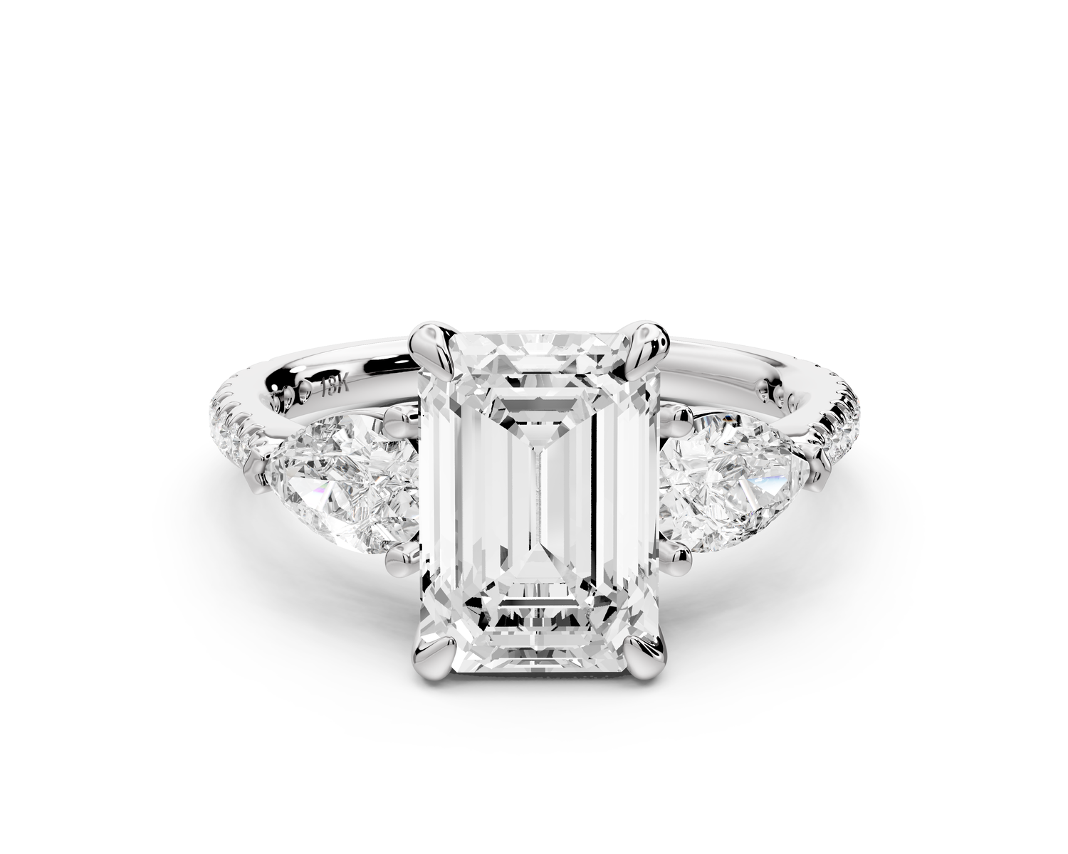 Alma - 2ct 14k white gold emerald center stone with two pear shaped diamonds and pavé. Three stone oval and pear Engagement ring with Pavé