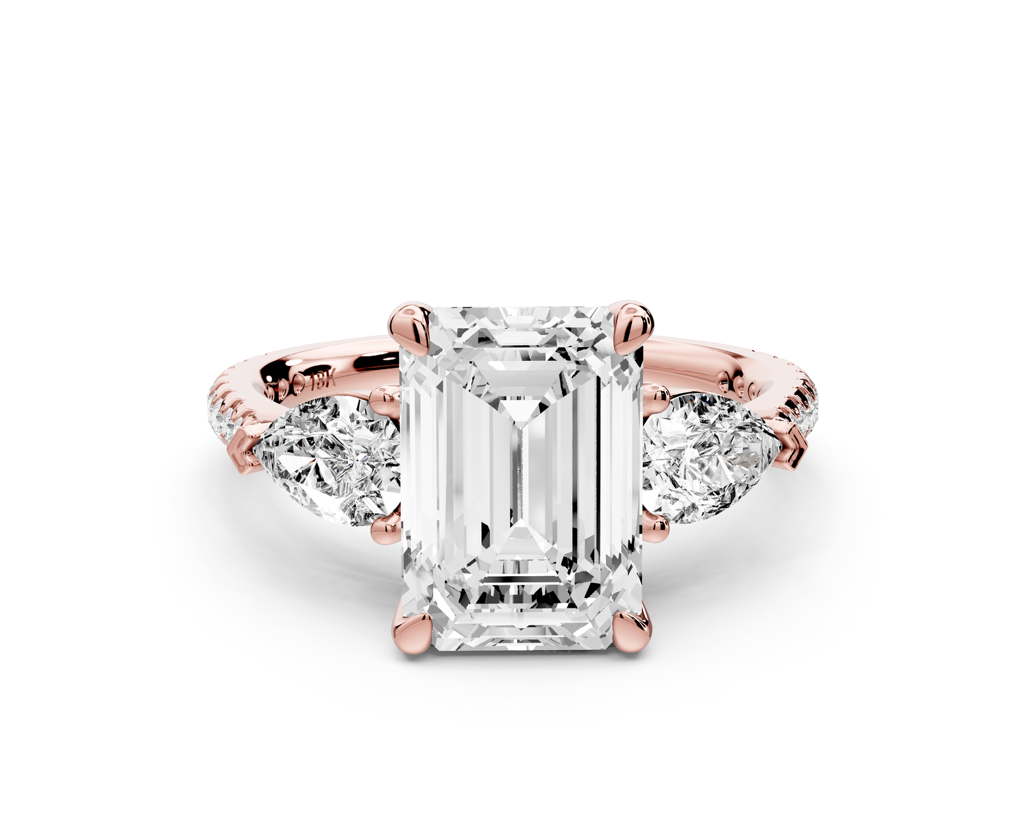 Alma - 3ct 14k rose gold emerald center stone with two pear shaped diamonds and pavé. Three stone oval and pear Engagement ring with Pavé