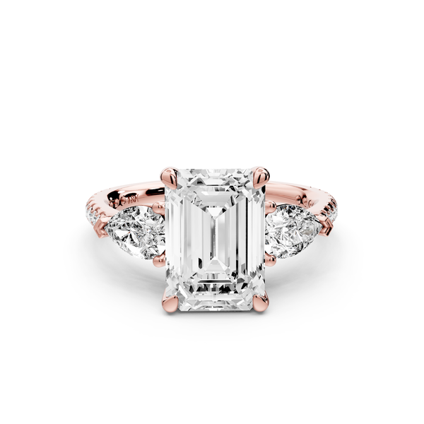 Alma - 3ct 14k rose gold emerald center stone with two pear shaped diamonds and pavé. Three stone oval and pear Engagement ring with Pavé