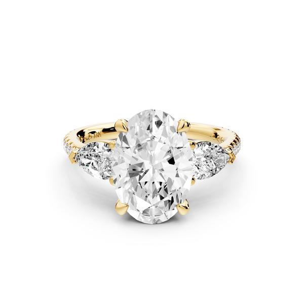 Alma - 3ct 14k yellow gold oval center stone with two pear shaped diamonds and pavé. Three stone oval and pear Engagement ring with Pavé