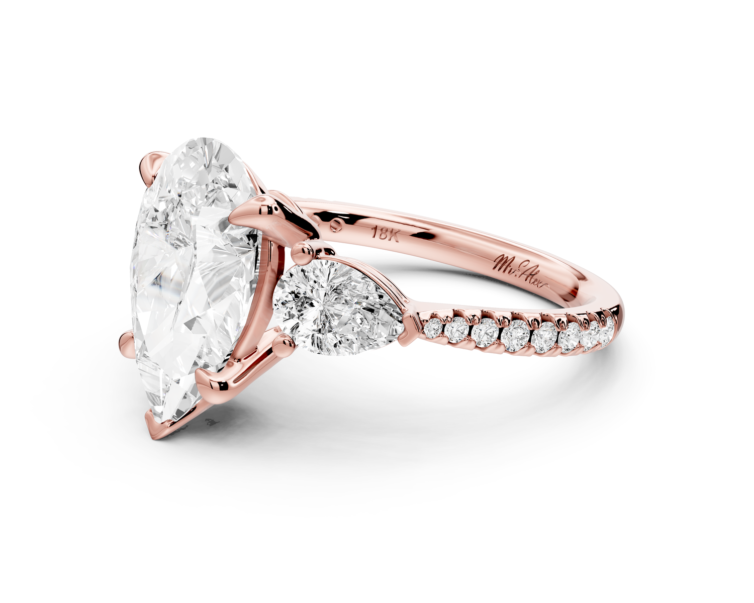 Alma - 3ct 14k rose gold pear center stone with two pear shaped diamonds and pavé. Three stone oval and pear Engagement ring with Pavé