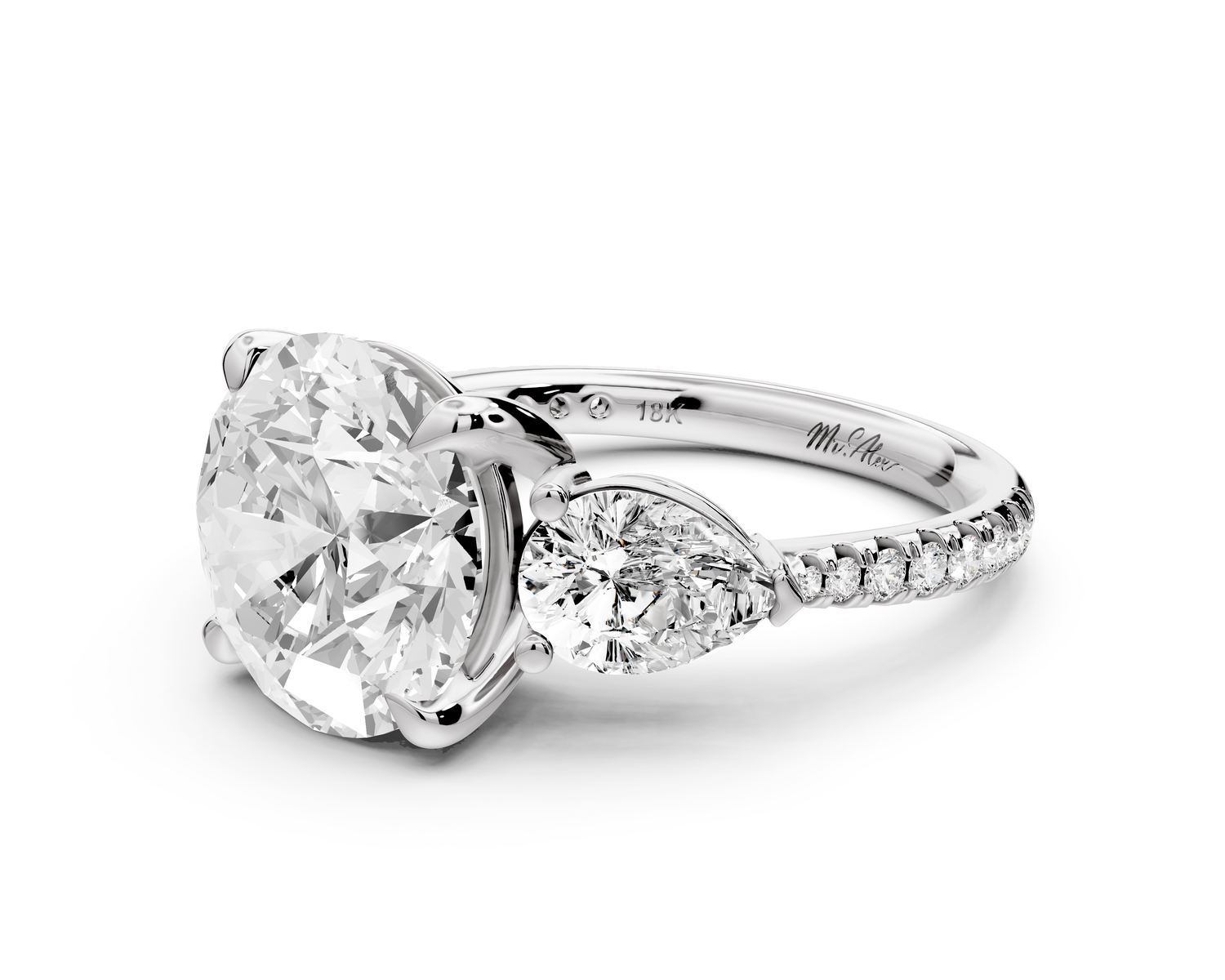 Alma - 4ct platinum round center stone with two pear shaped diamonds and pavé. Three stone oval and pear engagment ring with Pavé
