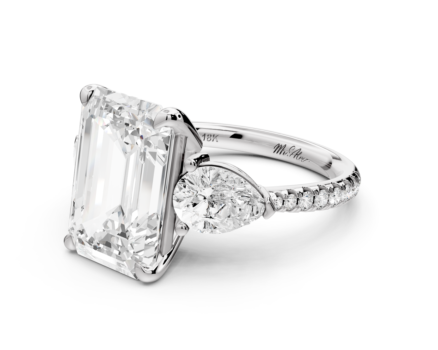 Alma - 5ct 14k white gold emerald center stone with two pear shaped diamonds and pavé. Three stone oval and pear Engagement ring with Pavé