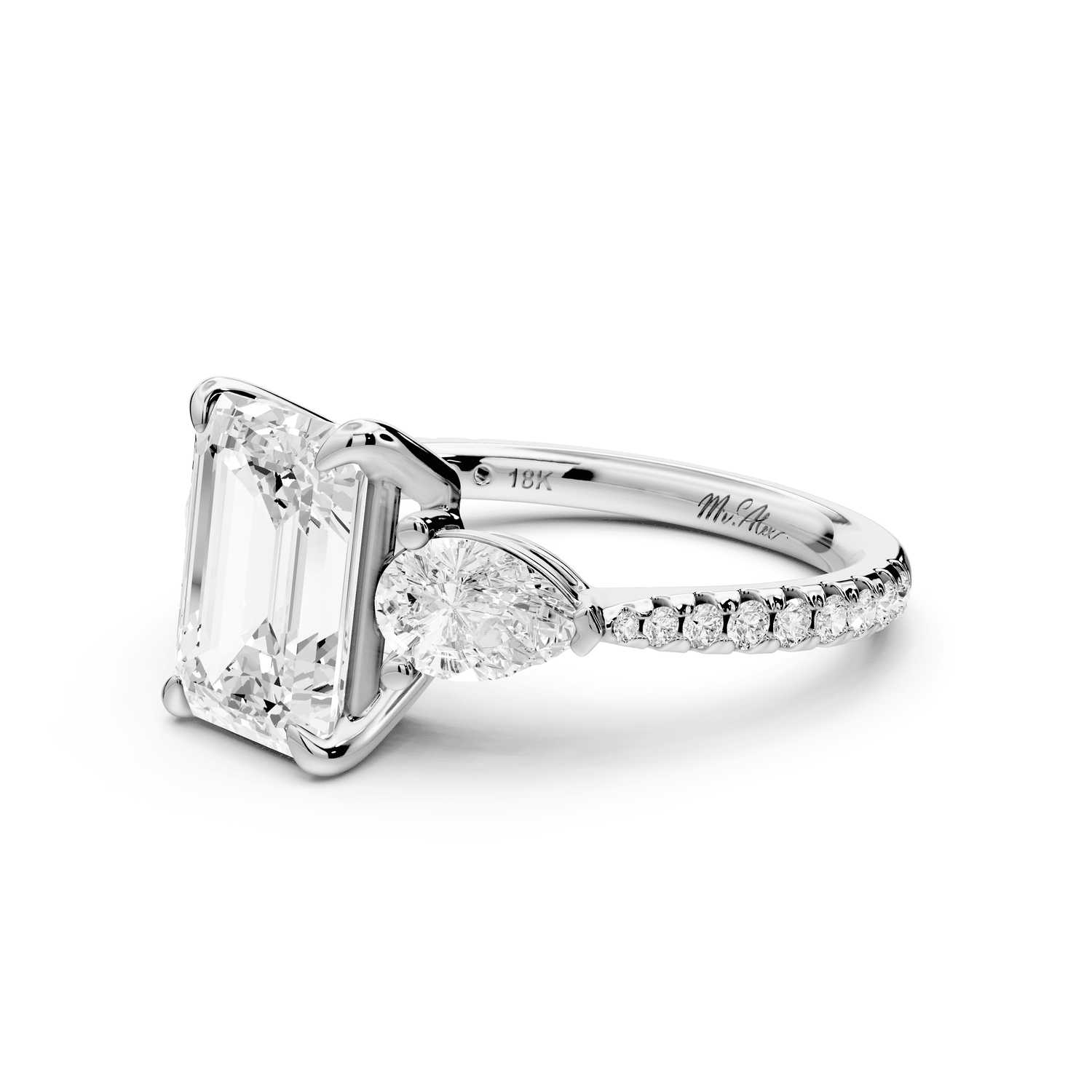 Alma - 2ct 18k white gold emerald center stone with two pear shaped diamonds and pavé. Three stone oval and pear Engagement ring with Pavé - Mr. Alex Jewelry