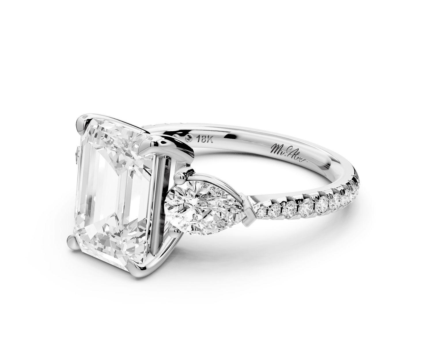 Alma - 3ct 18k white gold emerald center stone with two pear shaped diamonds and pavé. Three stone oval and pear Engagement ring with Pavé - Mr. Alex Jewelry