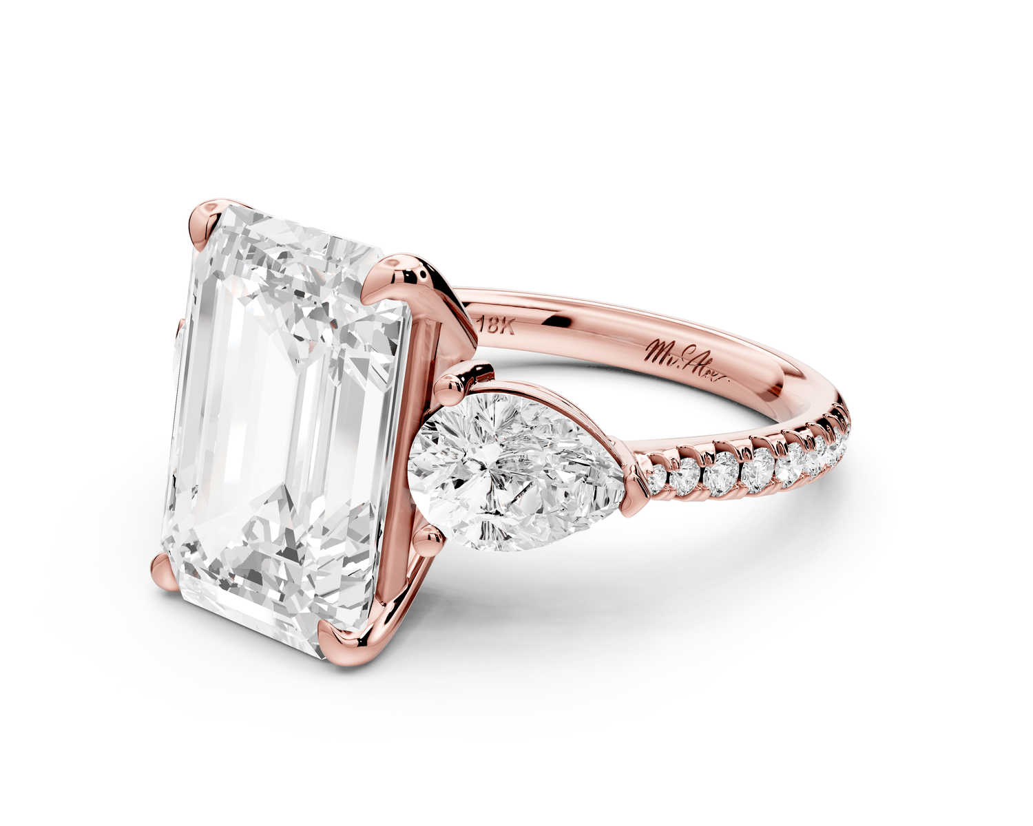 Alma - 5ct 18k rose gold emerald center stone with two pear shaped diamonds and pavé. Three stone oval and pear Engagement ring with Pavé - Mr. Alex Jewelry